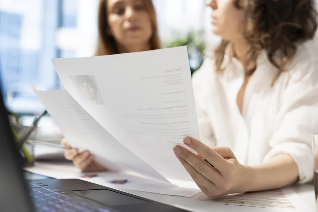 hr staff members analyzing candidates resumes office